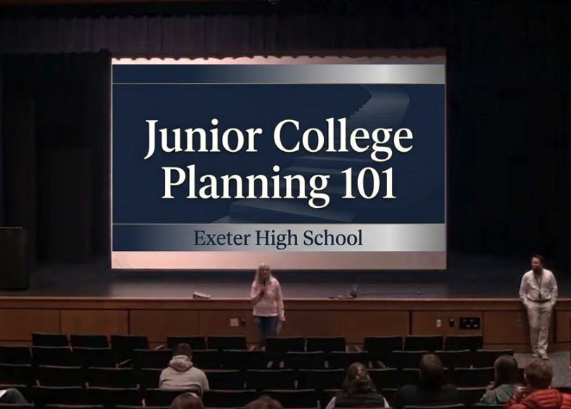 A stage with a screen in the center that says "junior college planning 101 Exeter High School"